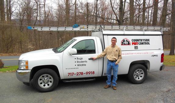 Joel with his Countryside Pest Control truck.